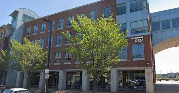 Picture of a red brick and grey cement multi-story building located in Charlestown, MA with the 